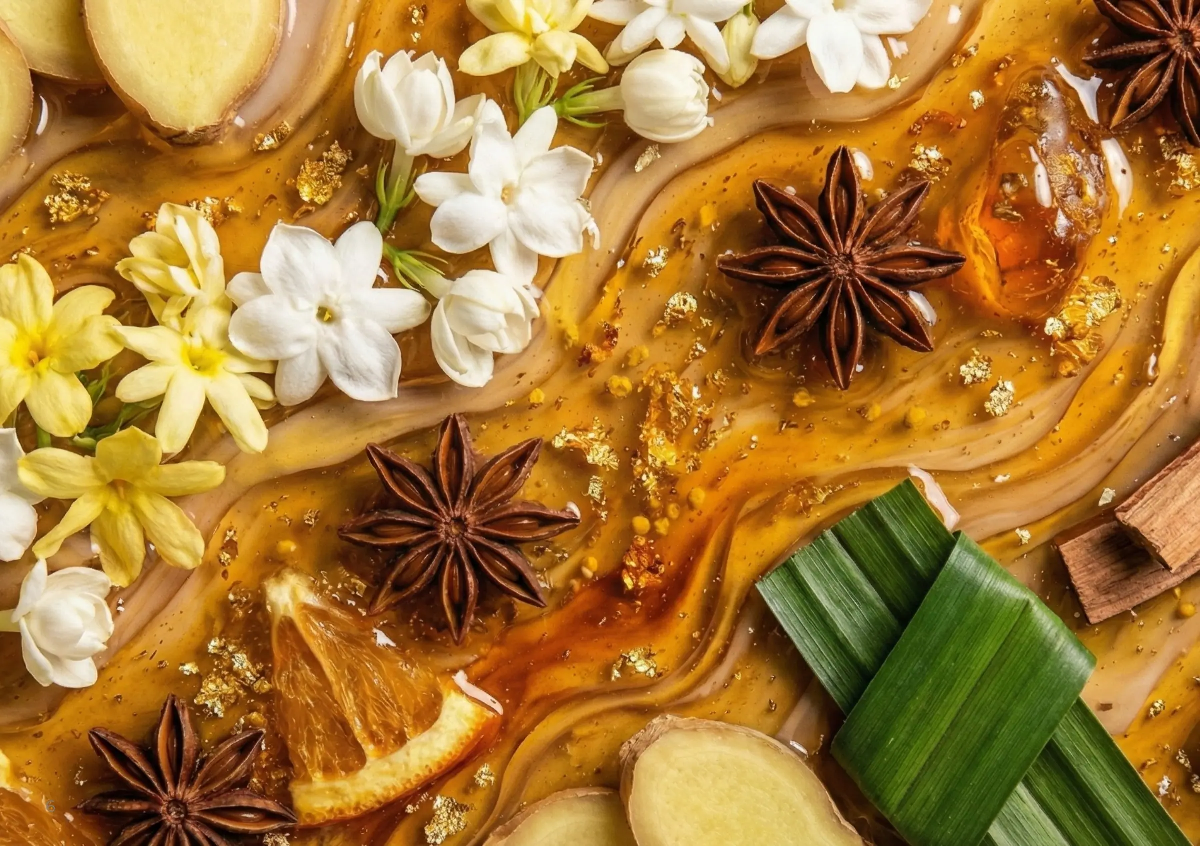 Jasmine, frangipani, ginger, pandan and star anise on swirls of amber